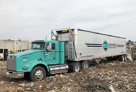 Special Hauling Warehouse Clean Out Truck at Landfill