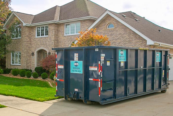 dumpster in home driveway