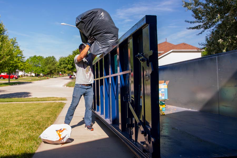 Loading a dumpster over the side