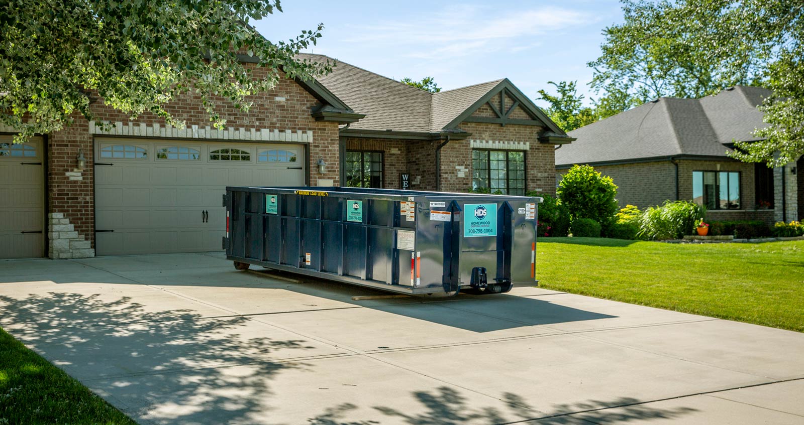20 yard dumpster on a driveway