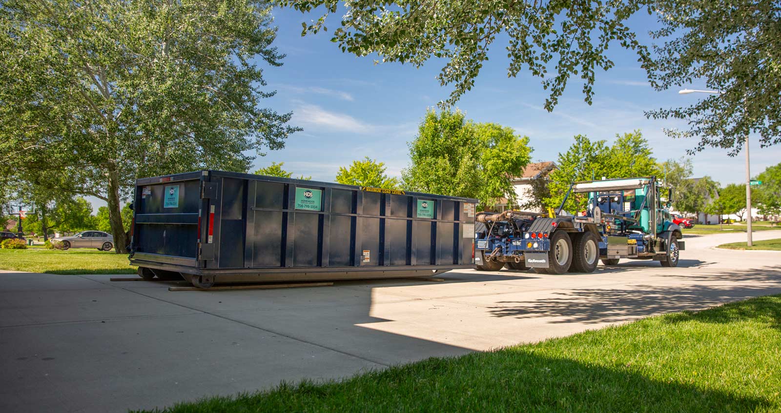 home-dumpster-drivewaywith-truck
