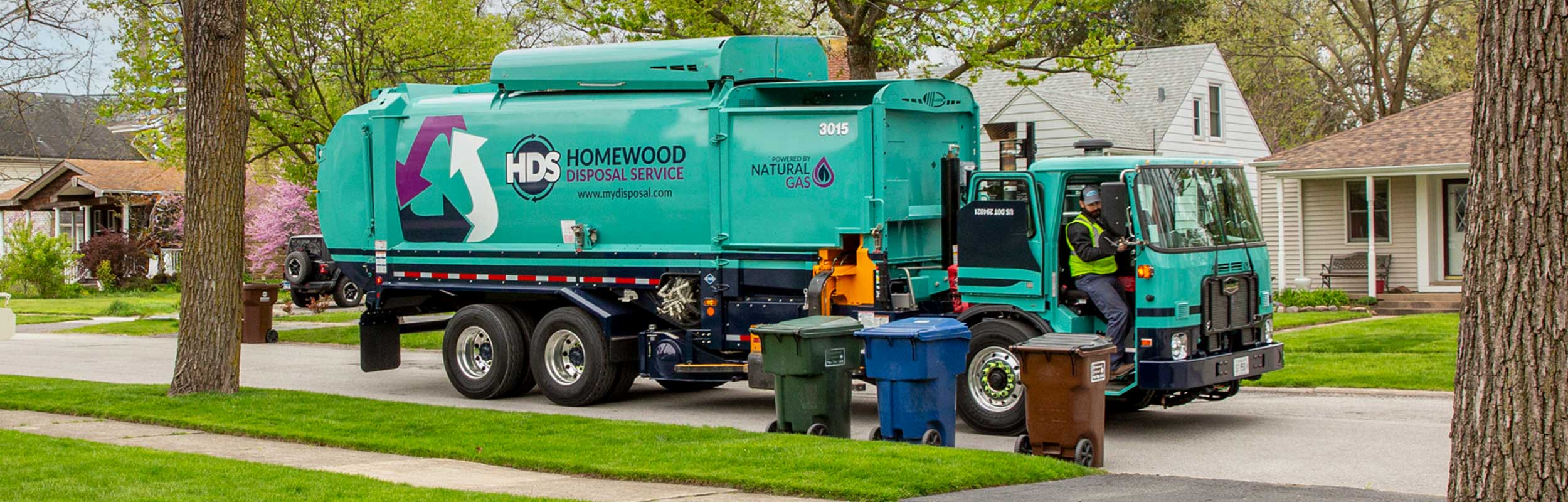 Homewood-Disposal-Garbage-truck picking-up-waste