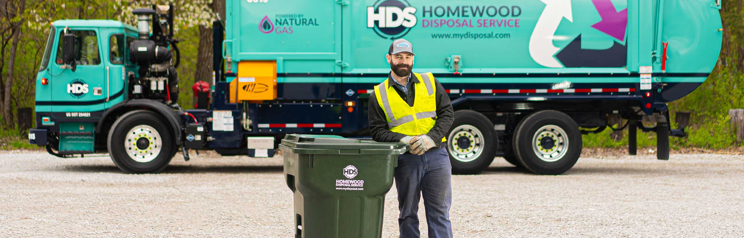 Homewood Disposal Garbage Collector in Front of Truck