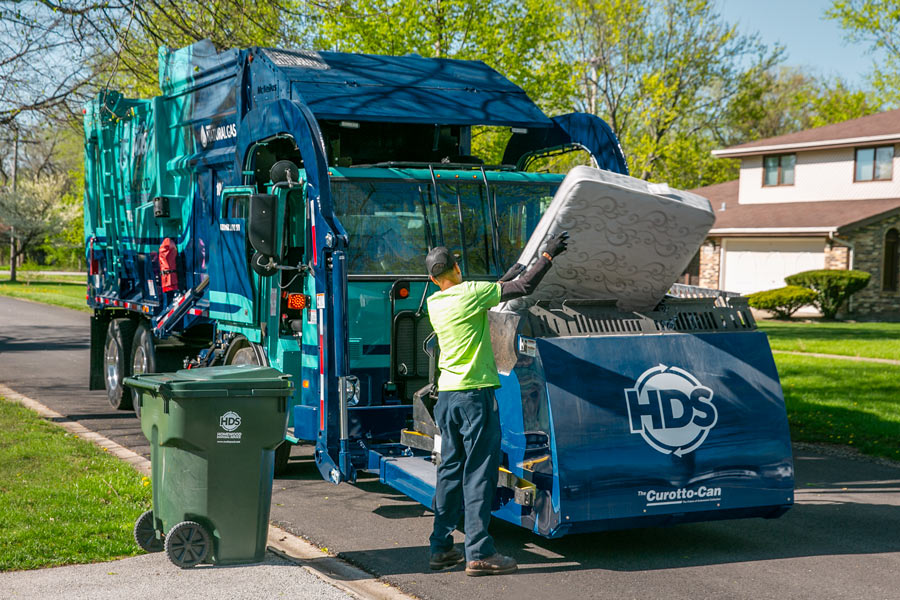 loading-large-item-garbage-truck